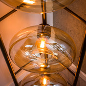 Sollara 4-lichts - vloerlamp met amberkleurig glas