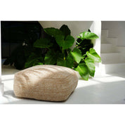 Comfortabele beige katoenen poef